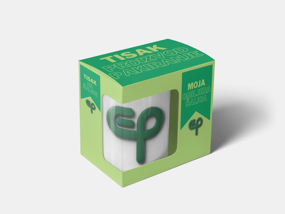 Zapakirana bijela šalica s logom u zelenoj kutiji s promotivnim naljepnicama